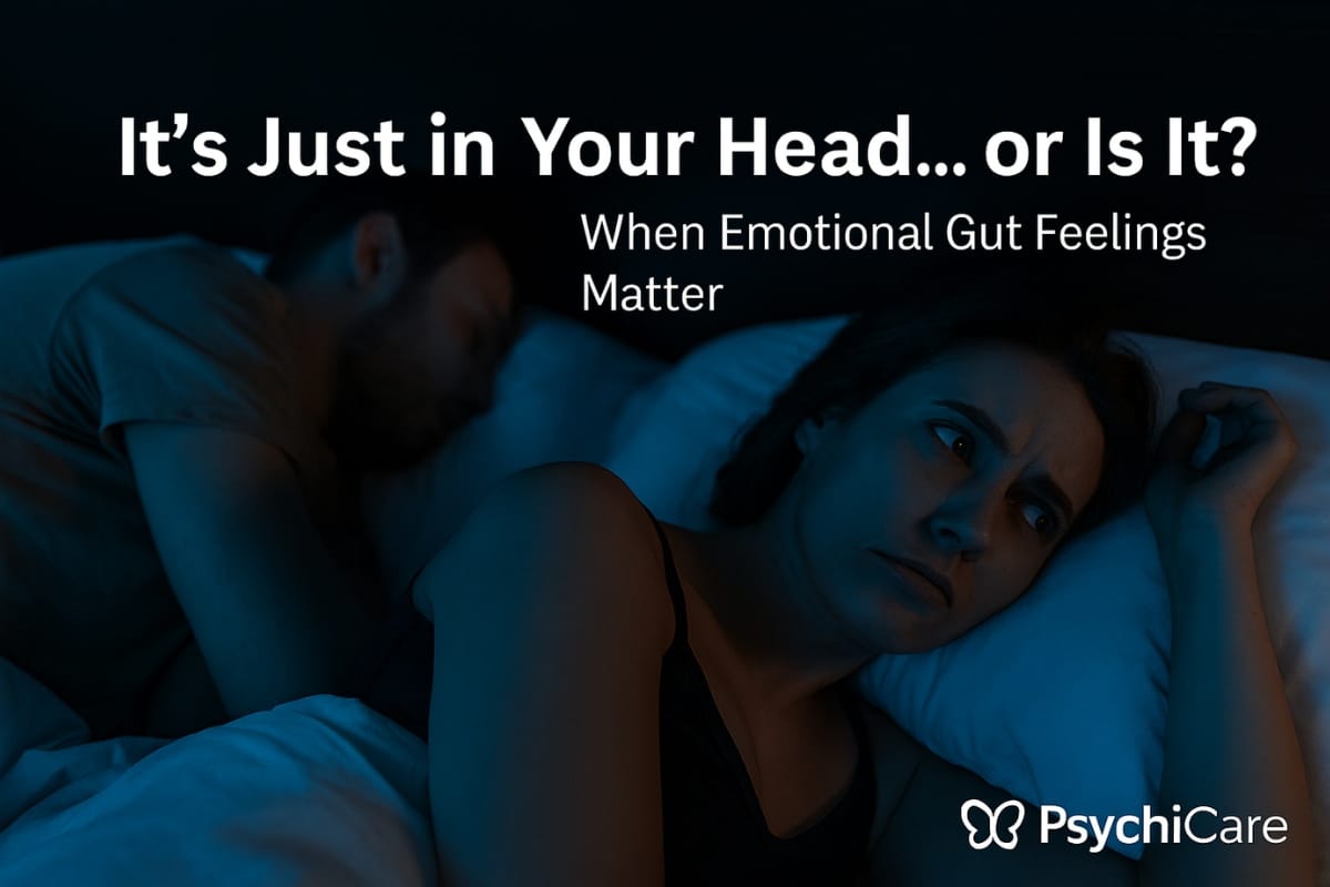 A woman lying awake next to her sleeping partner, looking distant and uncertain; overlaid text reads 'It’s Just in Your Head… or Is It? When Emotional Gut Feelings Matter' with PsychiCare branding