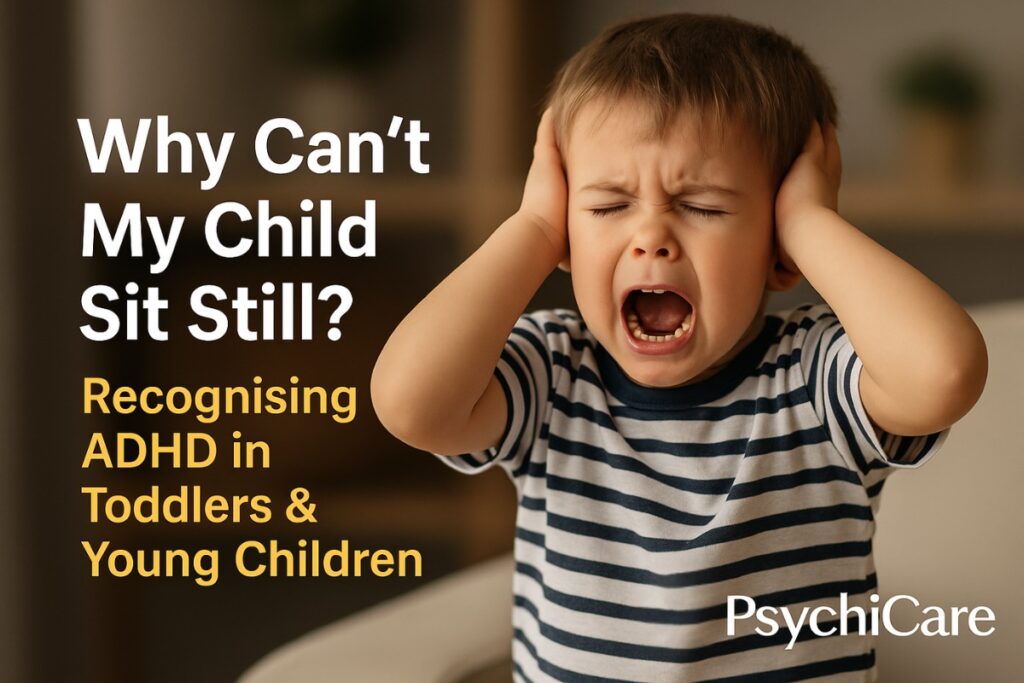 Frustrated toddler covering his ears and screaming, illustrating hyperactivity or distress, with bold text asking “Why Can’t My Child Sit Still?” and subtitle about recognising ADHD in young children, branded with the PsychiCare logo.