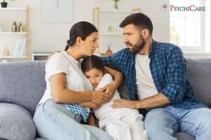 Anxious child showing signs of worry and overthinking while sitting quietly at home.