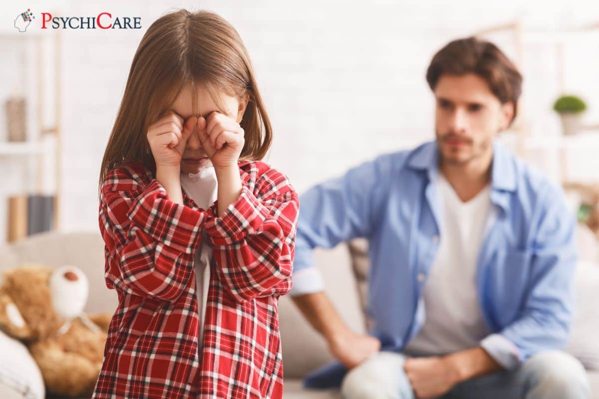 Parent calmly comforting an emotionally overwhelmed child at home and helping them manage strong feelings.